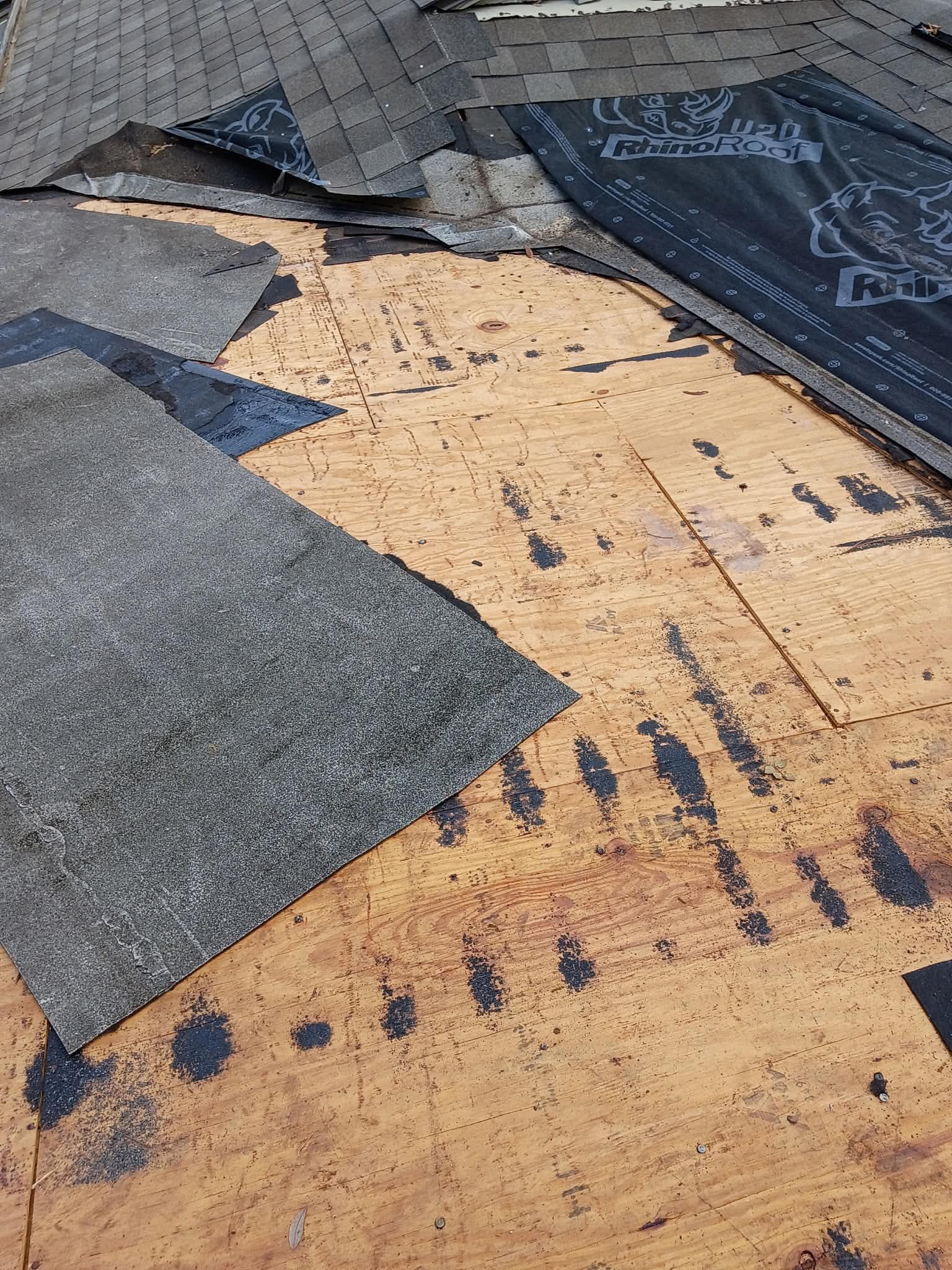 Exposed shingle roof deck during repair
